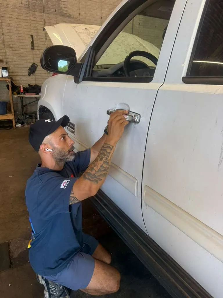 Yaniv, owner of Locksmith Solutions OKC, working a vehicle lockout in the Oklahoma City metro